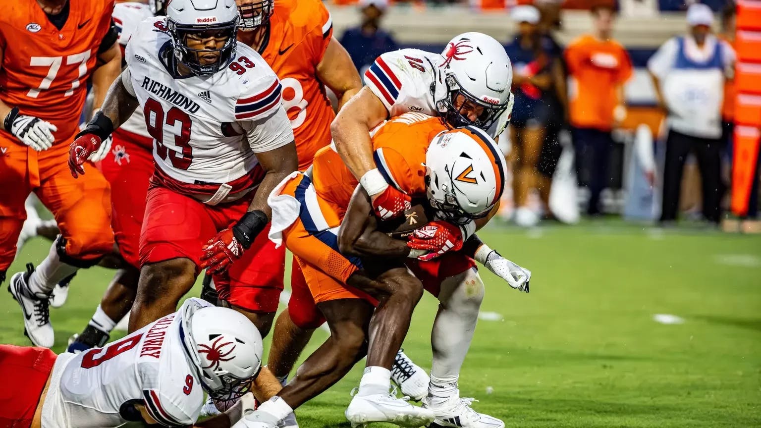 Redshirt sophomore linebacker Carter Glassmyer tackles UVA player during game in Charlottesville, VA on Sept. 1. Photo courtesy of Richmond Athletics.&nbsp;
