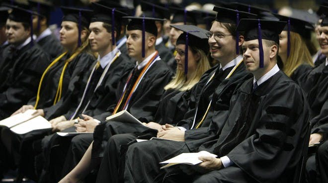 Members of a graduating class of T.C. Williams School of Law students observe commencement proceedings.