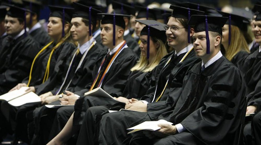 <p>Members of a graduating class of T.C. Williams School of Law students observe commencement proceedings.</p>