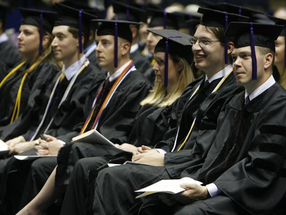 Members of a graduating class of T.C. Williams School of Law students observe commencement proceedings.