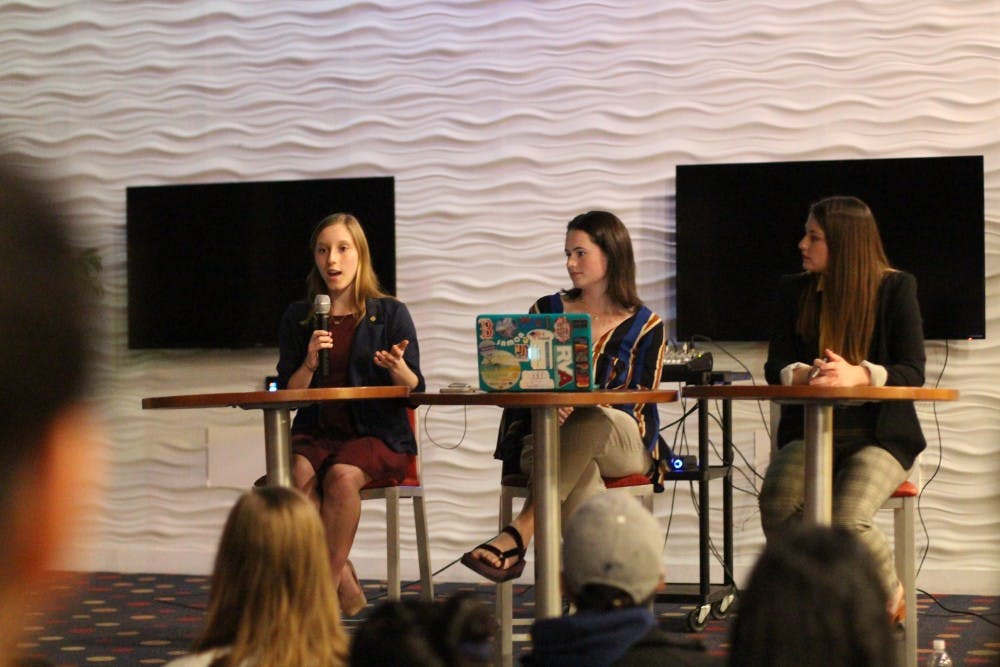 <p>Candidate Lindsey Paul (left), current WCGA president Monica Stack and candidate Claire Tate participate in a debate preceding the WCGA presidential election.</p>