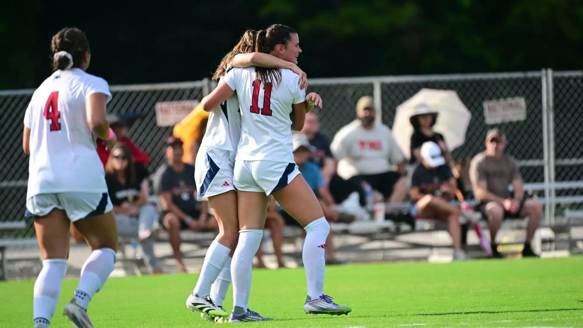 A teammate with first-year forward Emma Newman, who led the UR women's soccer team to victory on Thursday, Aug. 14. Courtesy of Richmond Athletics
