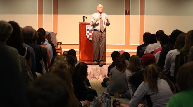 Joe Hoyle speaks in a room filled to capacity in the Jepson Alumni Center