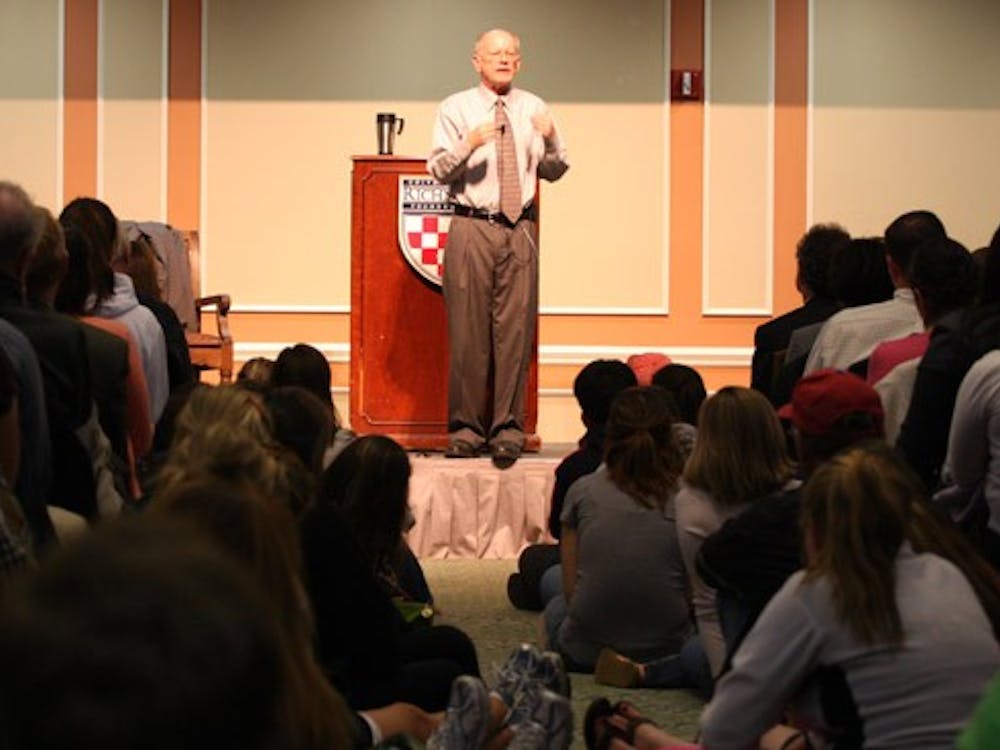 Joe Hoyle speaks in a room filled to capacity in the Jepson Alumni Center
