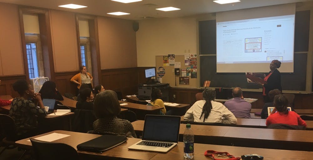 Free&nbsp;Egunfemi (right) speaks to University of Richmond community members at the Race and Racism forum.
