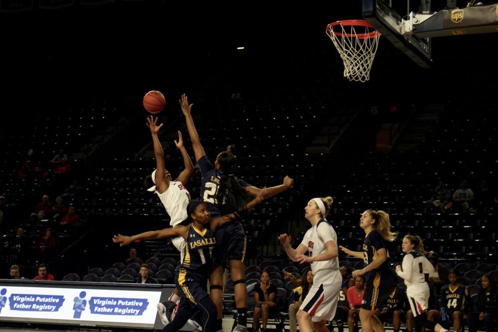 <p>Richmond's Micaela Parson shoots against La Salle defenders&nbsp;in the second quarter.&nbsp;</p>