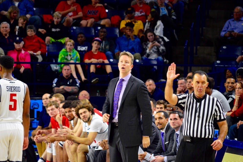 Richmond coach Chris Mooney instructs players from the sideline.&nbsp;