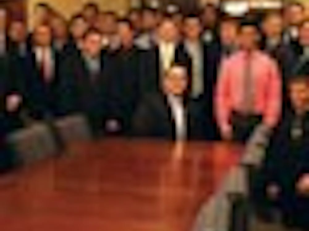 The 31 associate members of Lambda Chi Alpha, seen here with national representatives Matt Schultz and Patrick Voldness, accepted bids during a ceremony Sunday night in the Tyler Haynes Commons.