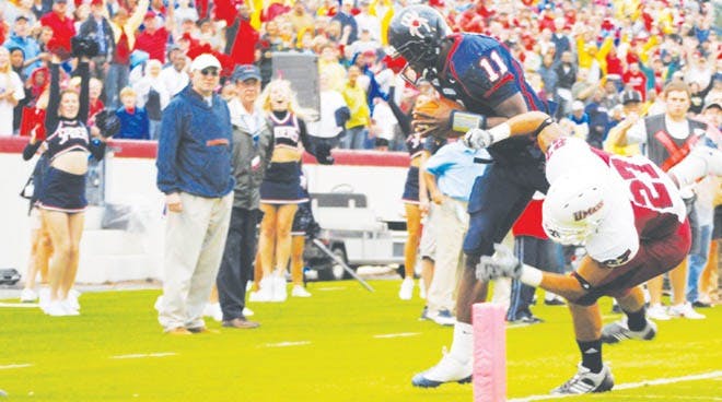 Quarterback Eric Ward gets tackled near the endzone during Saturday's game against UMASS.