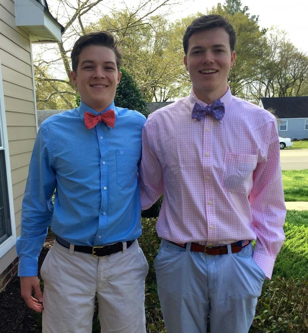 <p>Dylan Herman and Roger Coleman coordinated their Pig Roast outfits with bowties and button-down shirts.</p>