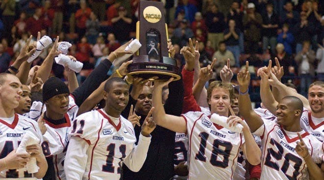 All together: Coach London, the Team, and the Championship Trophy