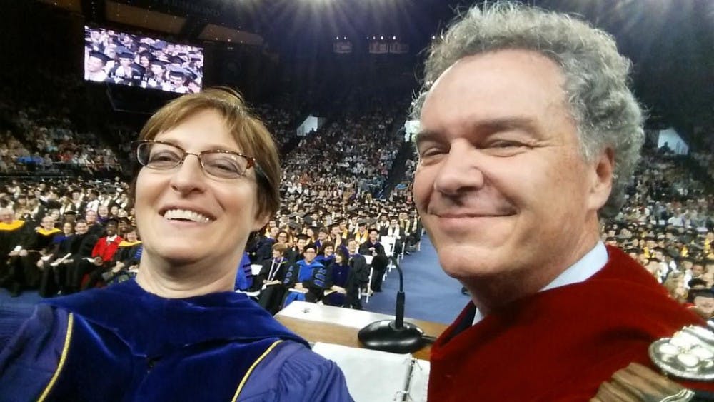 <p>Provost Jacquelyn Fetrow and former President Edward Ayers take a selfie at 2015 commencement. Photo courtesy of University of Richmond website.</p>