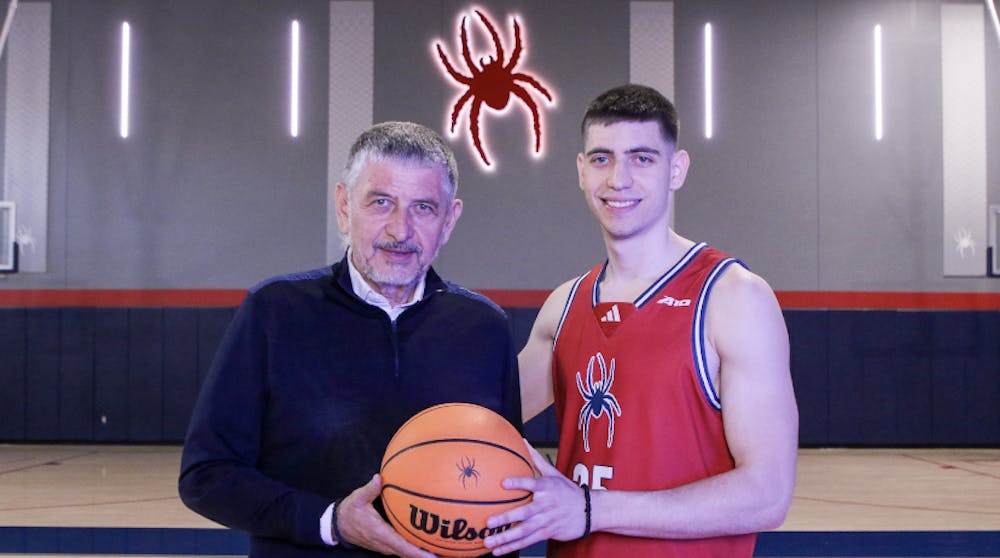 Dusan Neskovic (right) and his father, Branko Neskovic (left). Courtesy of Richmond Athletics.  