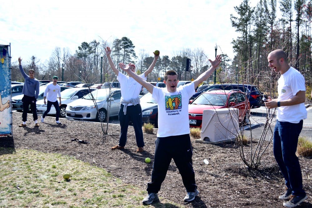 Will Daniel celebrates dunking Richmond student at the event.