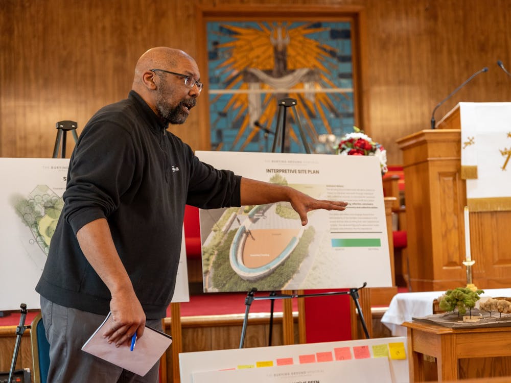 Burt Pinnock demonstrates the Westham Burying Ground memorial site plan to a group of descendants on Feb. 11 at the Pilgrim Journey Baptist Church. Pinnock is the lead architect behind the project and has been holding information sessions for UR community members since 2021.