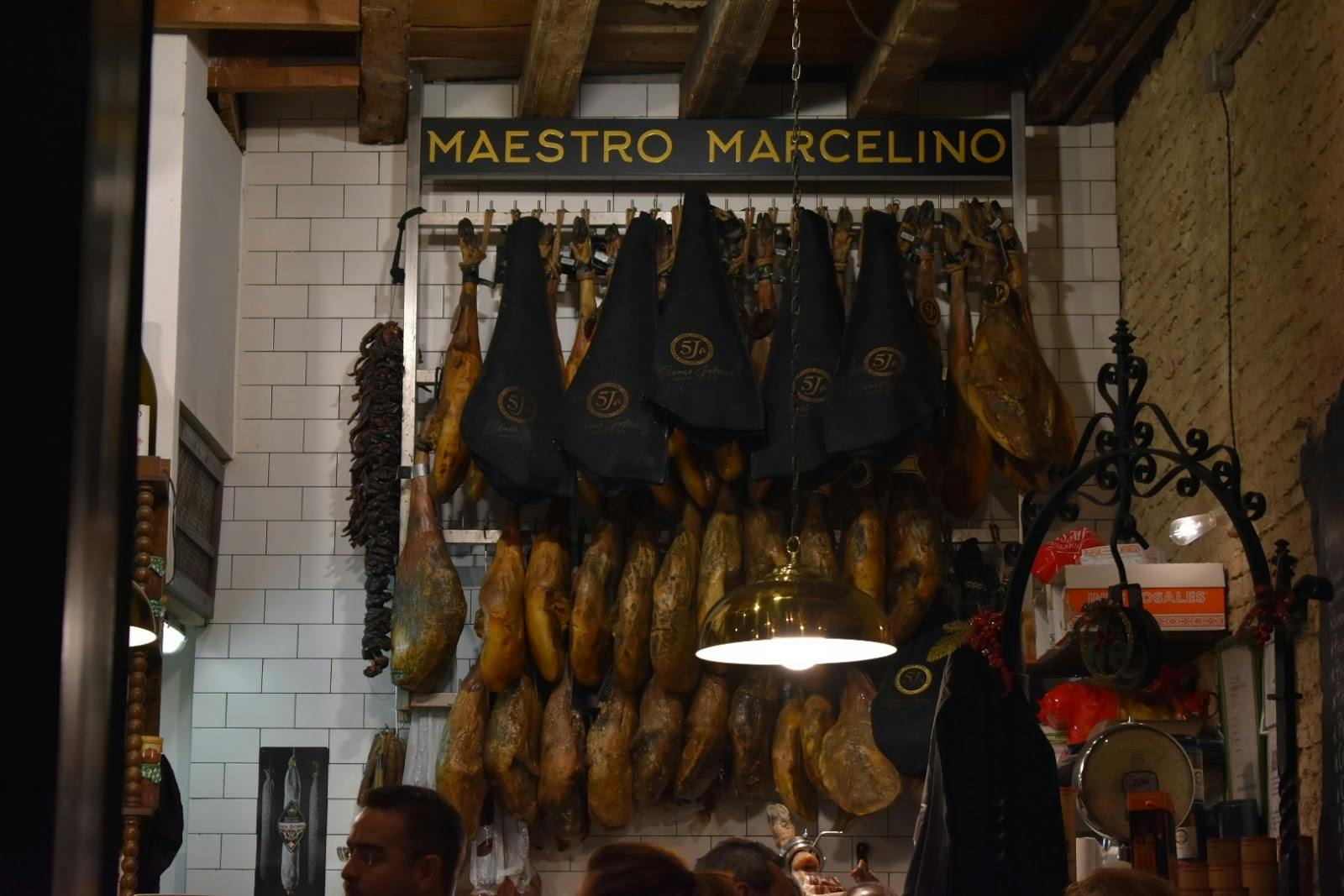 Jamón ibérico hanging in a restaurant in Seville, Spain, just before it had been served to customers.&nbsp;