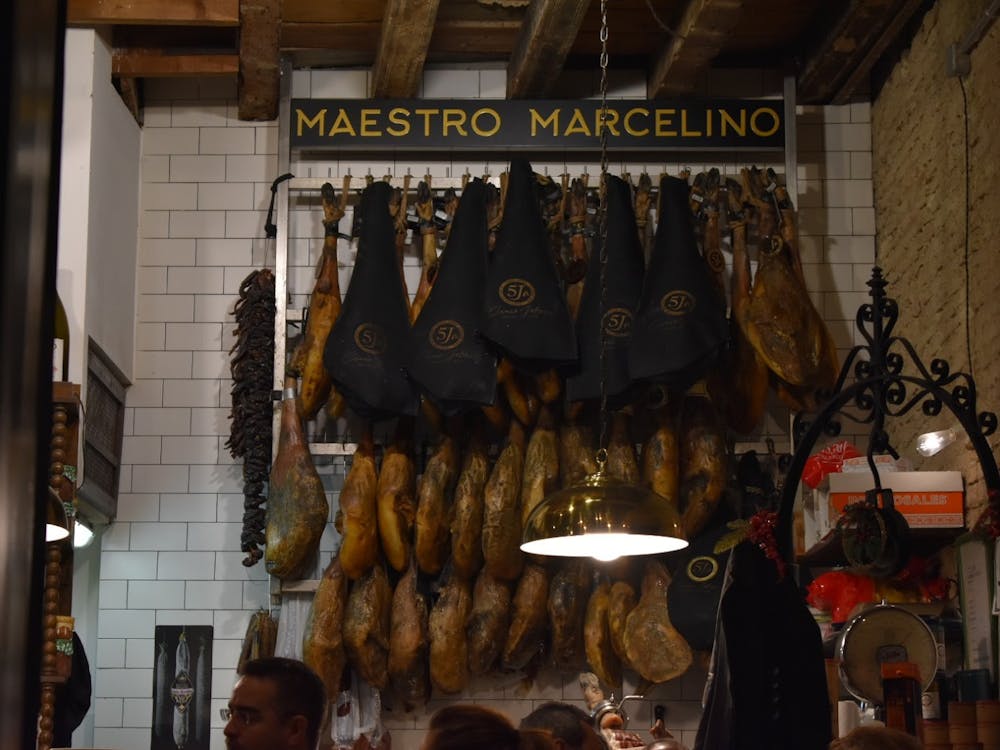 Jamón ibérico hanging in a restaurant in Seville, Spain, just before it had been served to customers.&nbsp;