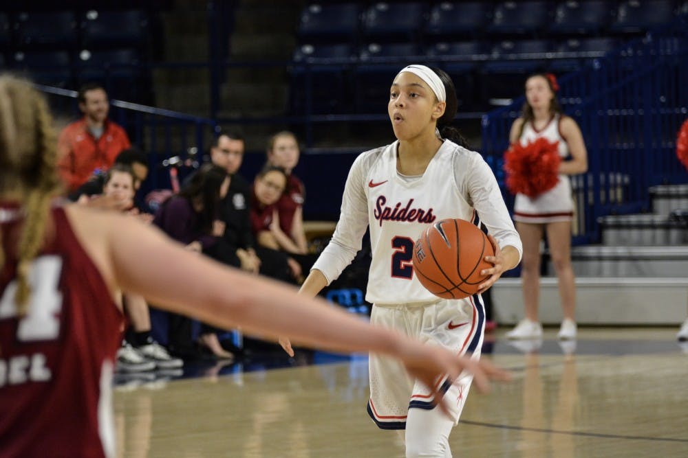 <p>Junior guard Aniyah Carpenter take the ball in 62-58 win over UMass in February 2019.&nbsp;</p>