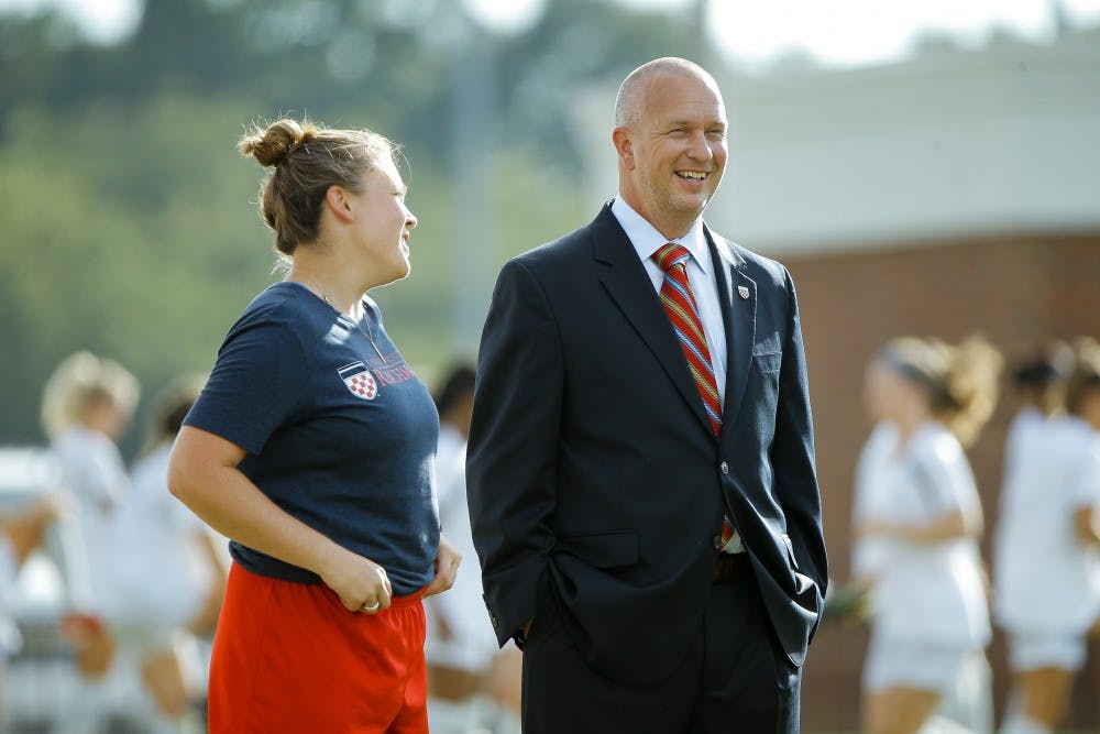 <p>Former head soccer coach Marty Beall (right).</p>