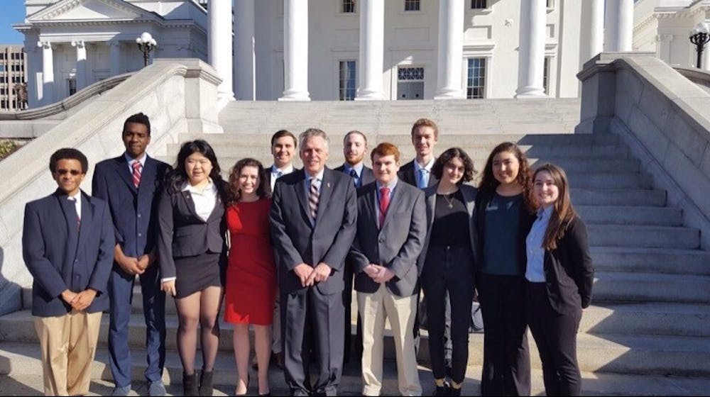 <p>Members of the College Democrats pictured with Governor of Virginia Terry McAuliffe in January 2017. Photo courtesy of Hunter Moyler.&nbsp;</p>