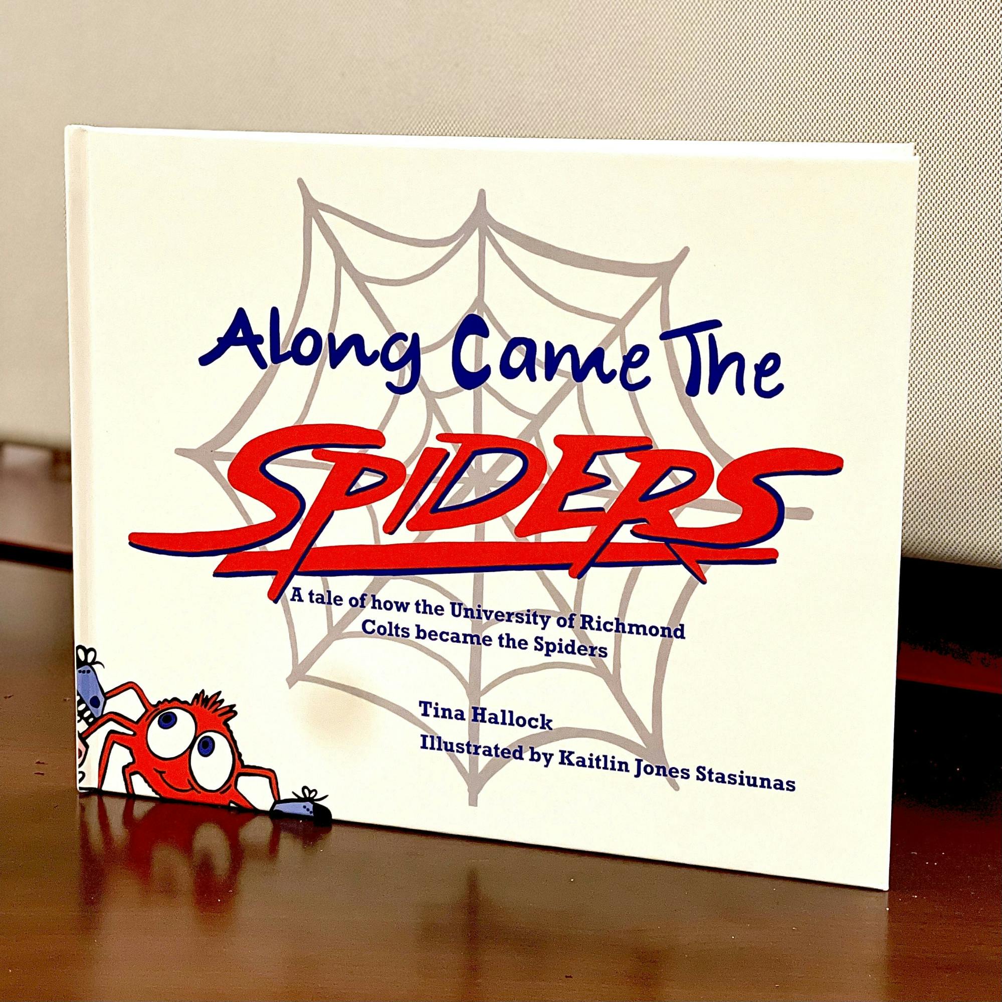A hardcover book of “Along come the spiders.”