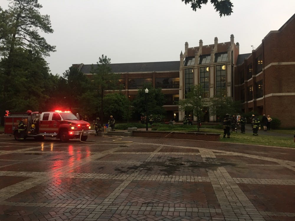 Fire fighters outside Gottwald Center for the Sciences after a fire broke out on the third floor on Wednesday evening.
