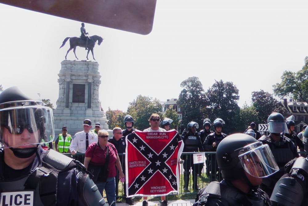 Protesters and counter-protesters alike gathered around the Robert E. Lee statue on Monument Avenue Saturday when members of a Tennessee-based pro-Confederate group arrived in Richmond and rallied in its defense.