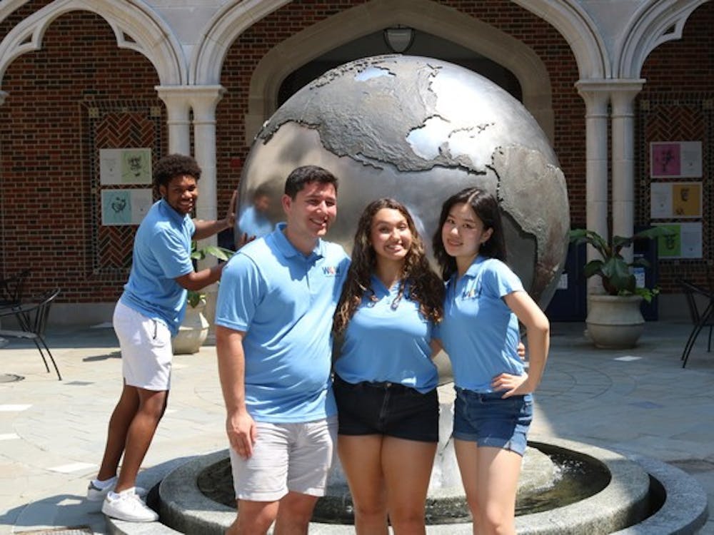WOW interns pose in the Carole Weinstein International Center. Photo courtesy of the Welcome to our Web page on Presence.
