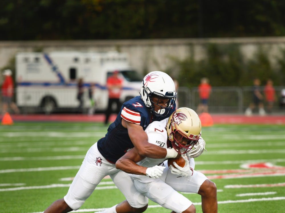 Defensive back and redshirt sophomore Noah Nicholson tackles Elon's wide receiver Kortez Weeks during a home game on Saturday, Sept. 14, 2019. 