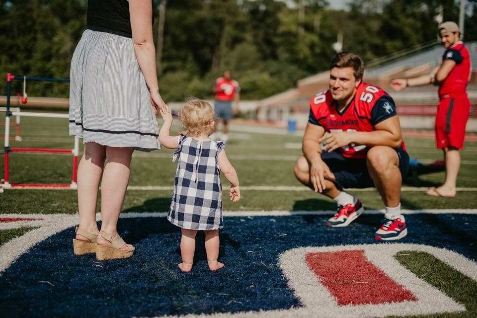 Yarbrough greets one of his fans at the annual Fan Fest this past summer at Robins Stadium. Photo courtesy of Richmond Athletics.