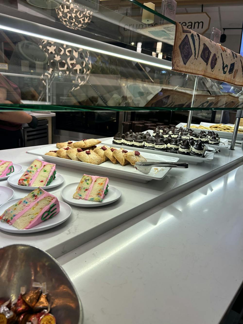 <p>“Happy Birthday Harry” cake, Sorting Hat cupcakes, Hogwarts letter cherry turnovers being served at Heilman Dining Center Harry Potter themed dinner.</p>