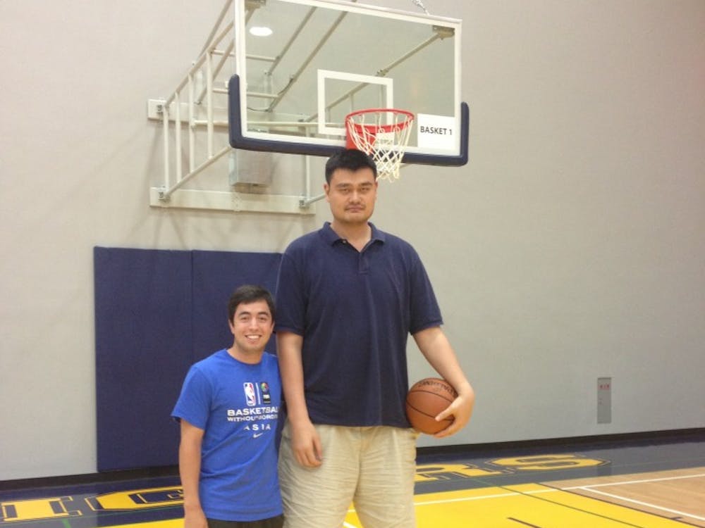Zachary Chu (left) with Yao Ming at the Basketball Without Borders camp in Taipei, Taiwan.
