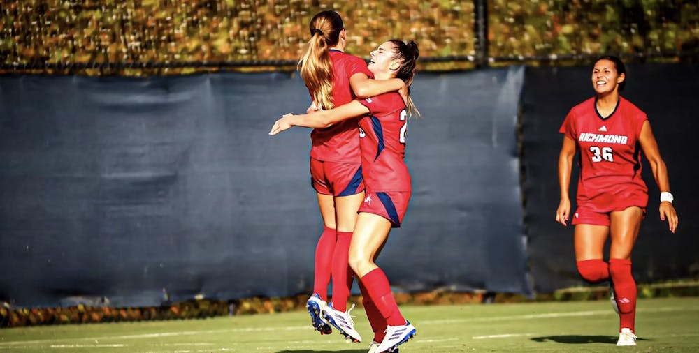 Midfielder junior Kiley Fitzgerald celebrating her first career goal with her teammates in a game against Duquesne University. Courtesy of Richmond Athletics. 