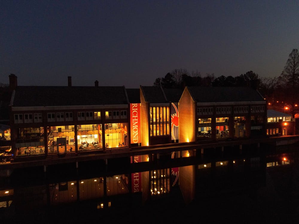 <p>Tyler Haynes Commons shines its reflection onto Westhampton lake.</p>