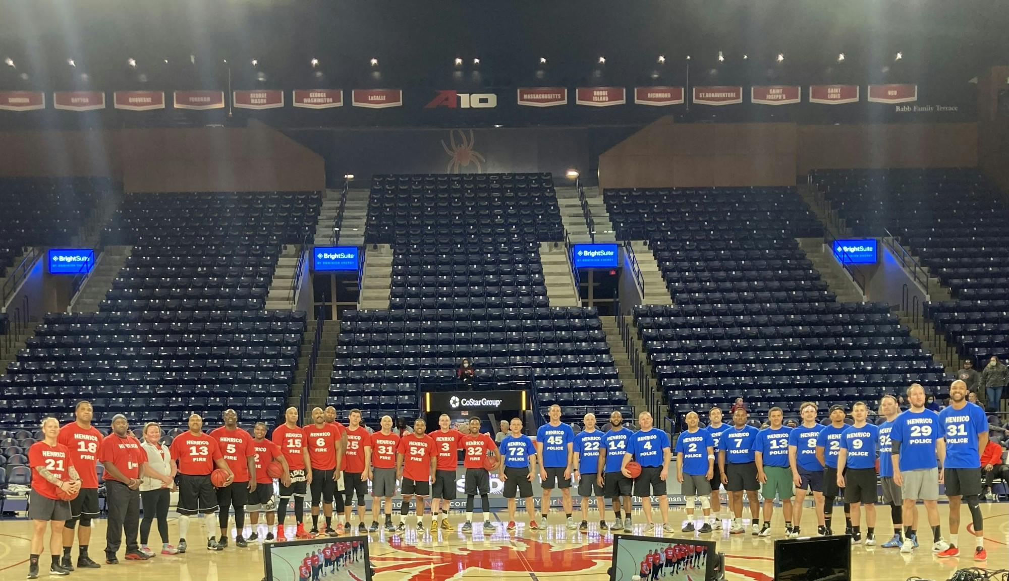 The Henrico County Division of Fire and the Henrico County Police Division pose for a picture after facing off at the Robins Stadium on Jan. 14.