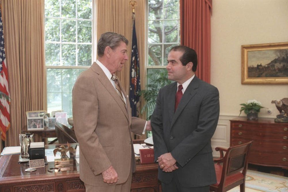 <p>President Ronald Reagan and Judge Antonin Scalia confer in the Oval Office, July 7, 1986 | Courtesy of&nbsp;Bill Fitz-Patrick/Wikimedia</p>