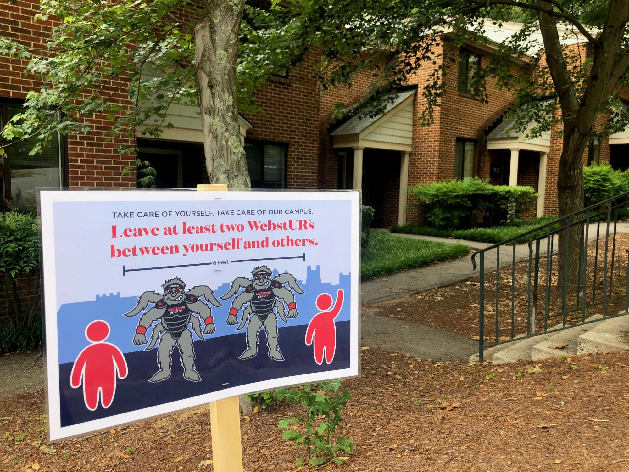 A sign located outside the University Forest Apartments reminds students to adhere to social distancing guidelines.&nbsp;