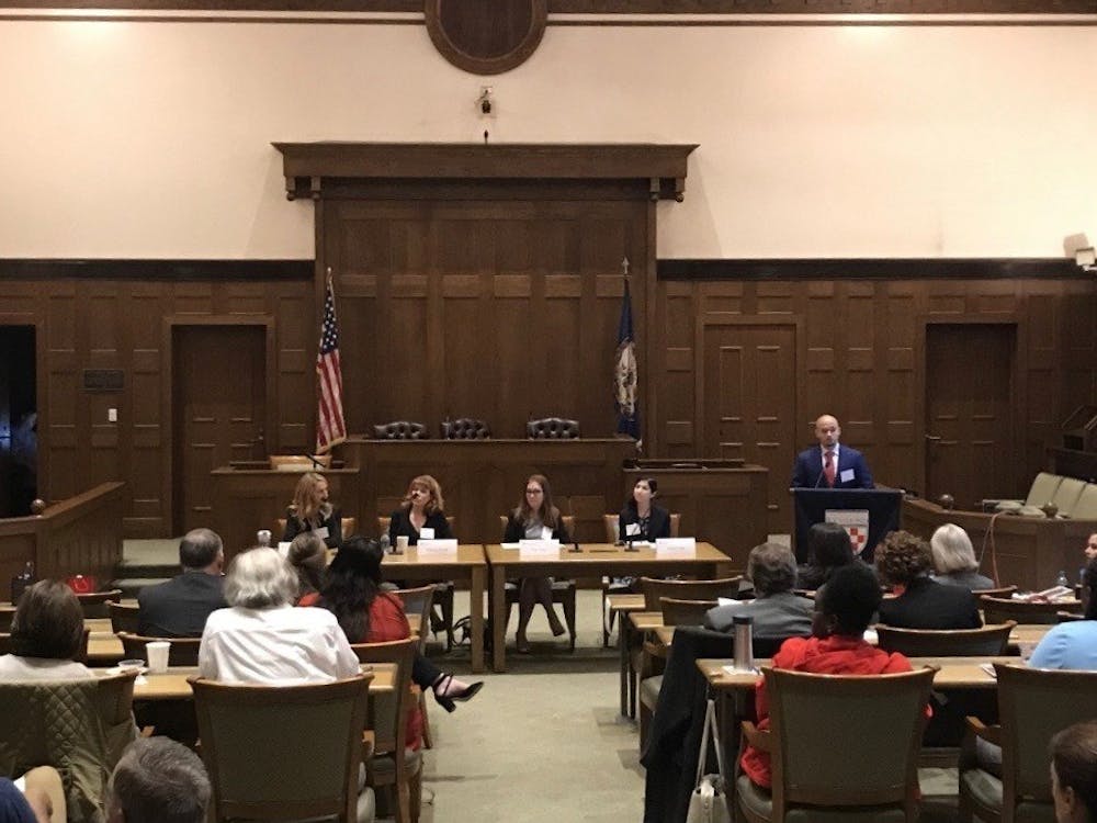 Panelists, from left to right, Patty Gill, Rebecca Royals, Kati Dean and Janice Craft discussed their perspectives on sexual harassment in the workplace. Professor Kevin Woodson, at far right podium, moderated the discussion.