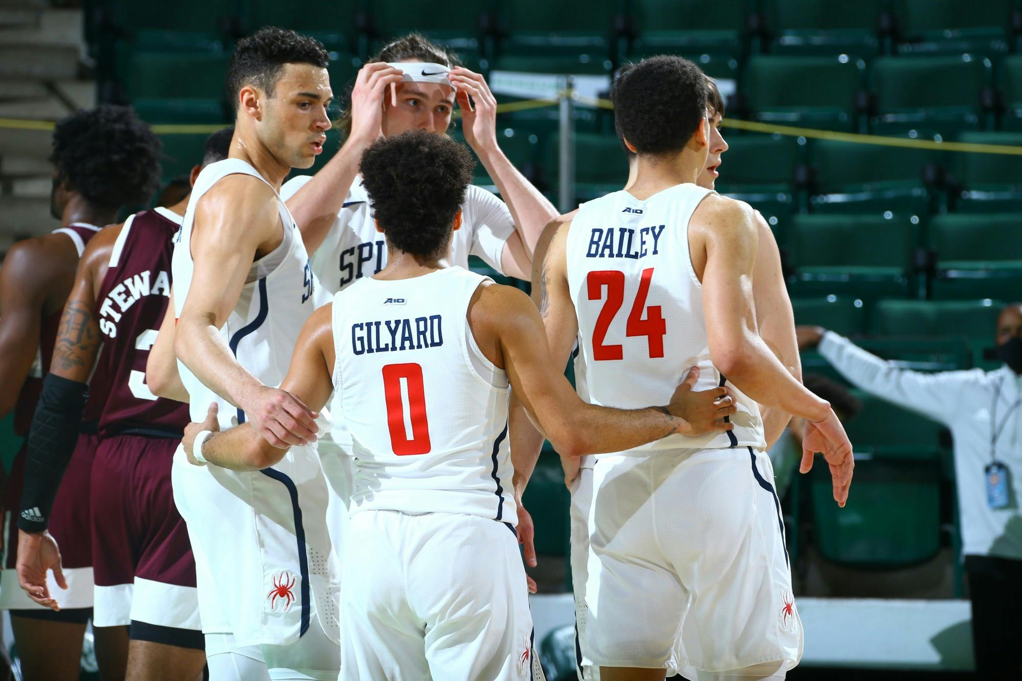 Richmond Spiders' guard Jacob Gilyard gathers his team in a huddle during the National Invitation Tournament quarterfinals at the UNT Coliseum on Thursday, Mar. 26, 2021. Photo courtesy of the NCAA