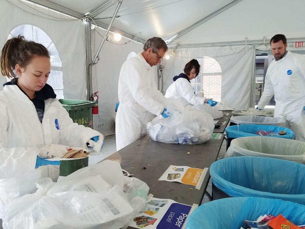 Volunteers help sort compostable, recyclable and landfill waste to find out how much was diverted from the landfill during the zero-waste game. Photo courtesy of&nbsp;the University of Richmond Sustainability Facebook page.