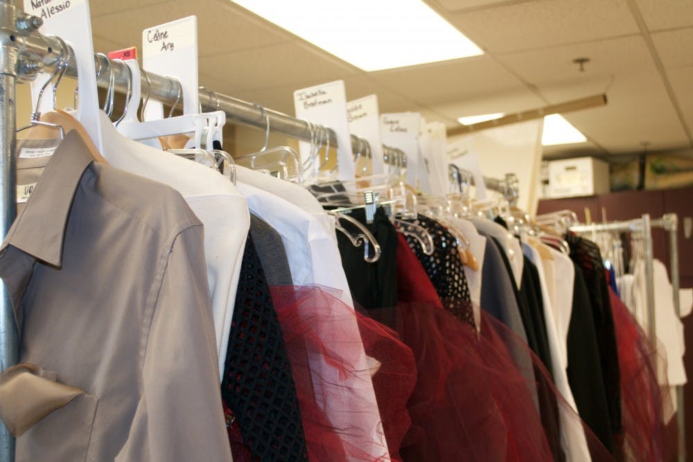 <p>Each costume is handmade then organized into racks by dancer.</p>