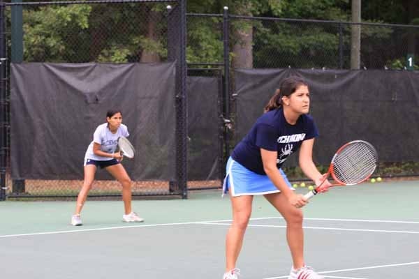 Pamela Duran, '09, and Isabel Arana, '11, playing as doubles partners