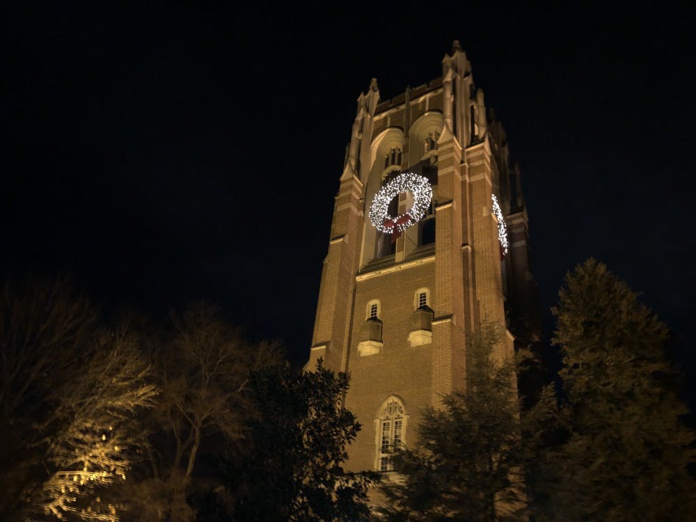 <p>The wreaths illuminated at night on Boatwright Memorial Library.&nbsp;</p>