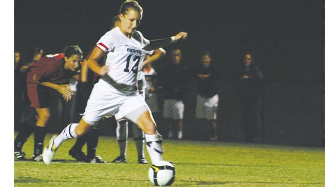 Senior Kelsey Rdzanek puts away a penalty kick to secure the win over Davidson.
