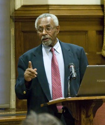 Dr. Befekadu Degefe speaks during a forum on the global economy.