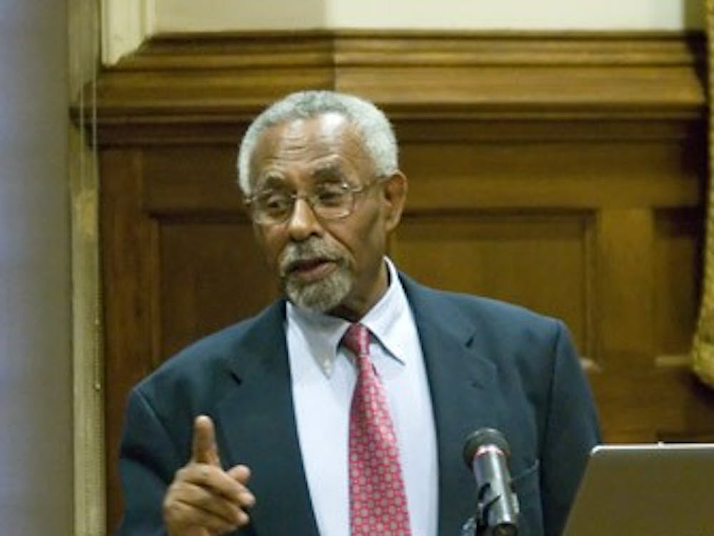 Dr. Befekadu Degefe speaks during a forum on the global economy.