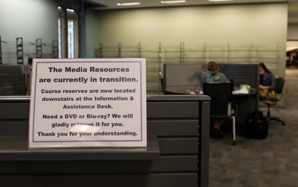 A sign in the MRC directs students to the new temporary location of course reserves and DVDs.&nbsp;