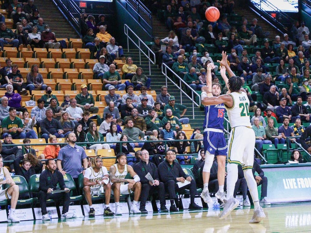Graduate student Matt Grace shoots a three-pointer during the away game against George Mason on Dec. 31. Photo courtesy of Richmond Athletics. 