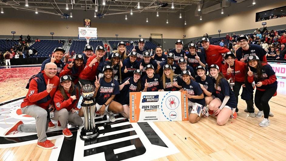 The Spiders celebrate their victory over the University of Rhode Island on March 10. Courtesy of Richmond Athletics.