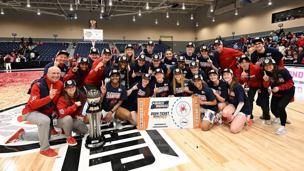 The Spiders celebrate their victory over the University of Rhode Island on March 10. Courtesy of Richmond Athletics.